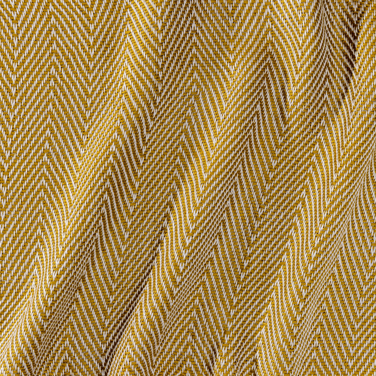 Elegant bamboo herringbone throw blanket in Natural & Brass, blending cozy softness with refined style.