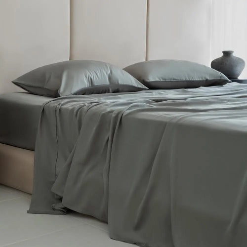 Luxe bamboo sheets in muted sage offer silky comfort and a grounded, nature-inspired vibe