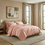 Blush-toned bedding in quartz brings gentle warmth and softness to contemporary interiors