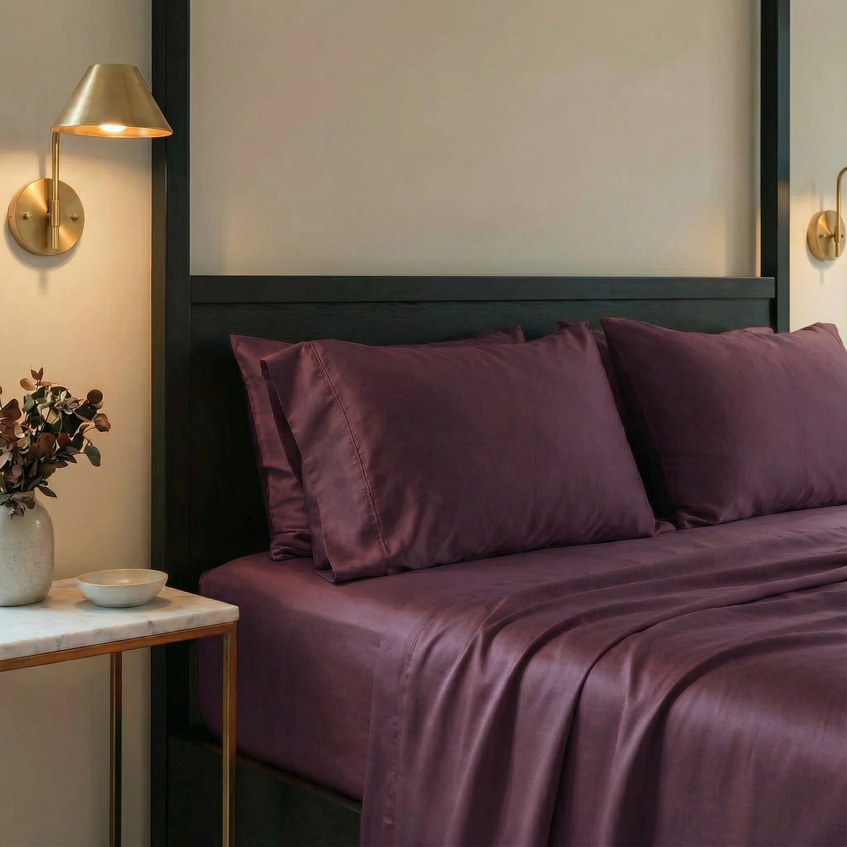 Luxe fig pillowcases offer a bold counterpoint to soft textures, balancing elegance with edge