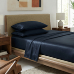 Warm modern bedroom featuring luxe bamboo sateen sheets in elegant indigo