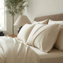 Soft mica pillowcases bring a warm, neutral touch to a serene, modern bedroom