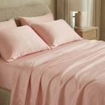 Modern bedroom with silky-soft sateen sheets in quartz pink