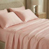 Modern bedroom with silky-soft sateen sheets in quartz pink